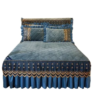 Stock Summer Kantha Quilt Bedspread on the Bed India Embroidery Bed Liner Skirt