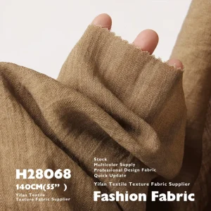 vintage washed cotton fabric with faded drape and wrinkle-resistant printed texture for clothing dresses and trousers
